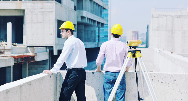 Team of business people in group, architect and engeneer  on construciton site check documents and business workflow on new building